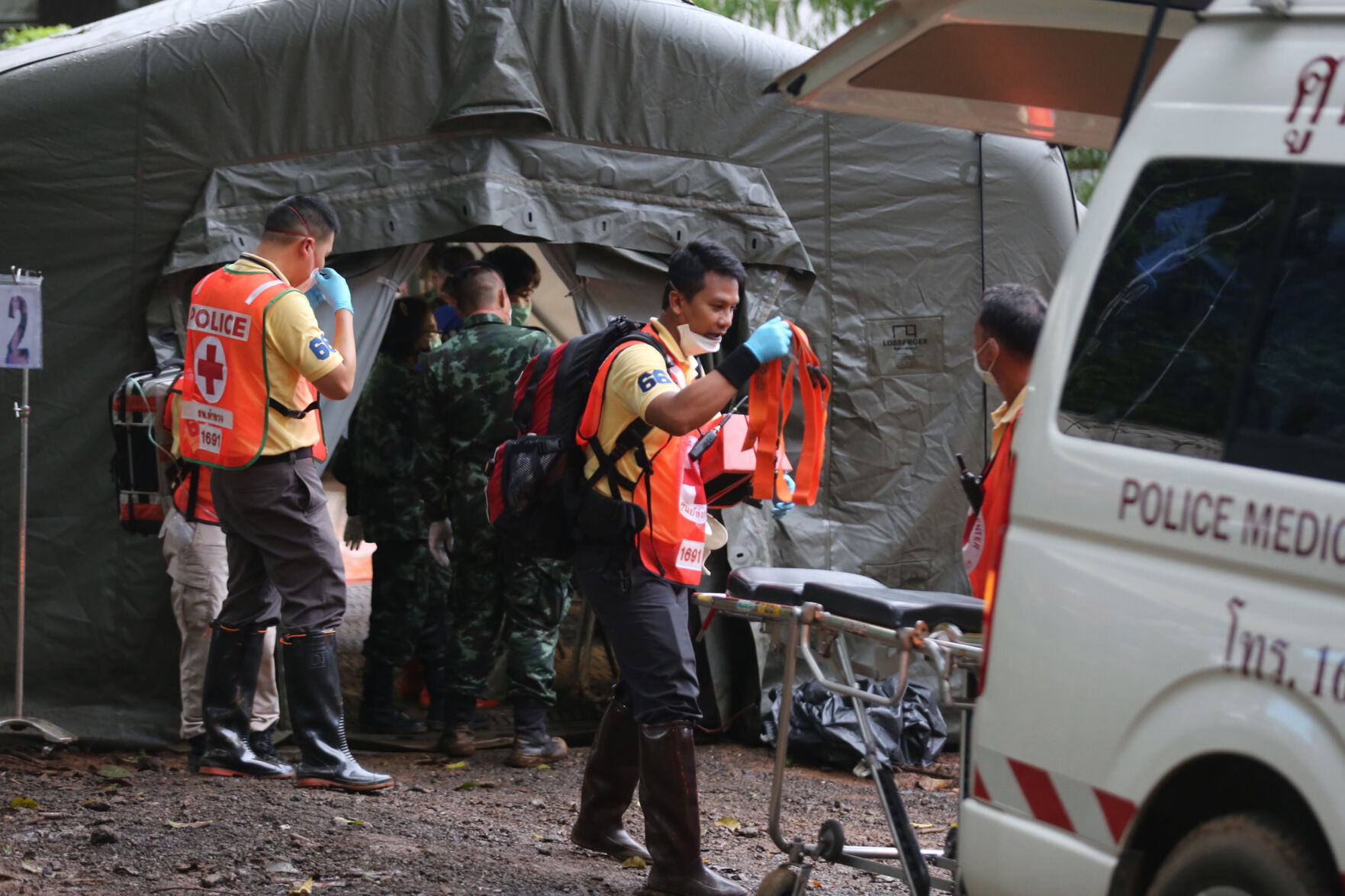Rescuers near cave